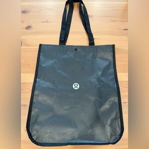 lululemon Black and White Tote Bag with Snap Closure
